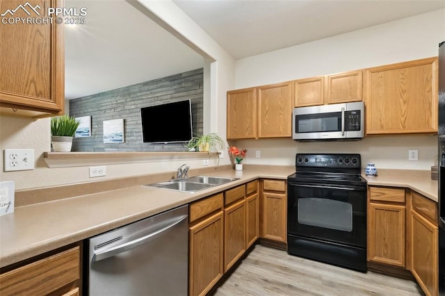 7524 Sandy Springs Pt, Fountain, CO 80817 - kitchen featuring appliances with stainless steel finishes, light wood-style flooring, and light countertops