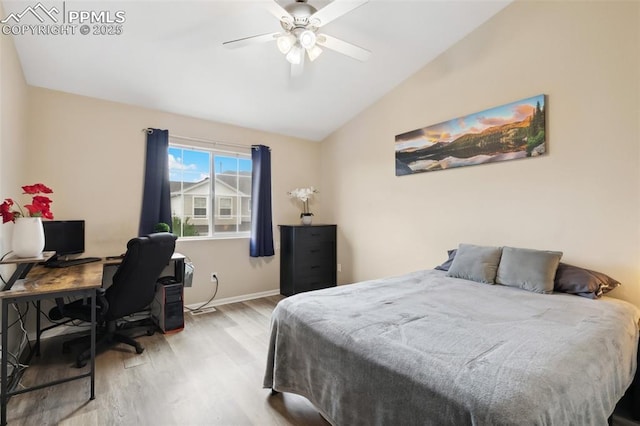 7524 Sandy Springs Pt, Fountain, CO 80817 - bedroom featuring wood finished floors, vaulted ceiling, a desk, and ceiling fan