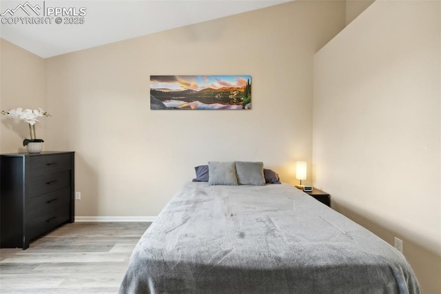 7524 Sandy Springs Pt, Fountain, CO 80817 - bedroom featuring light wood finished floors and lofted ceiling