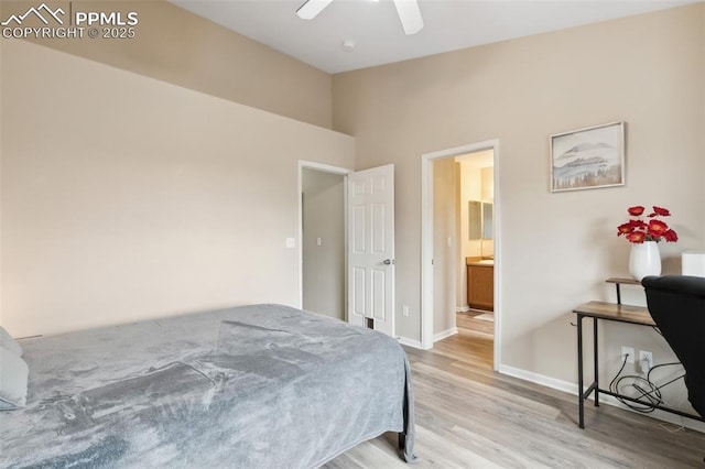 7524 Sandy Springs Pt, Fountain, CO 80817 - bedroom featuring wood finished floors, a towering ceiling, a ceiling fan, and connected bathroom