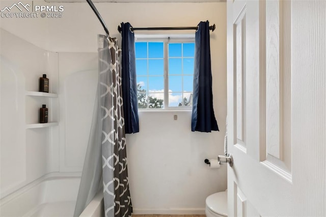7524 Sandy Springs Pt, Fountain, CO 80817 - bathroom with toilet and shower / bathtub combination with curtain