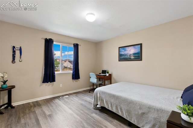 7524 Sandy Springs Pt, Fountain, CO 80817 - bedroom with wood finished floors and baseboards