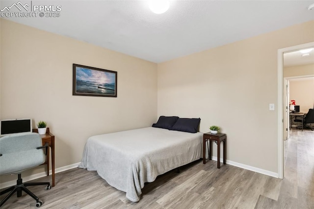 7524 Sandy Springs Pt, Fountain, CO 80817 - bedroom featuring light wood-style floors and a desk