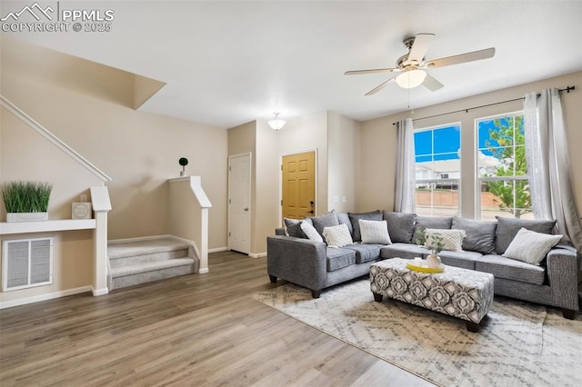7524 Sandy Springs Pt, Fountain, CO 80817 - living room with wood finished floors, stairs, and ceiling fan