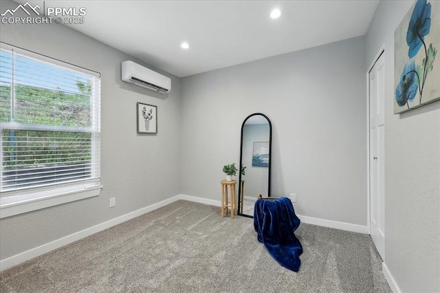 1112 Modes St, Colorado Springs, CO 80904 - empty room featuring an AC wall unit, carpet, baseboards, and recessed lighting