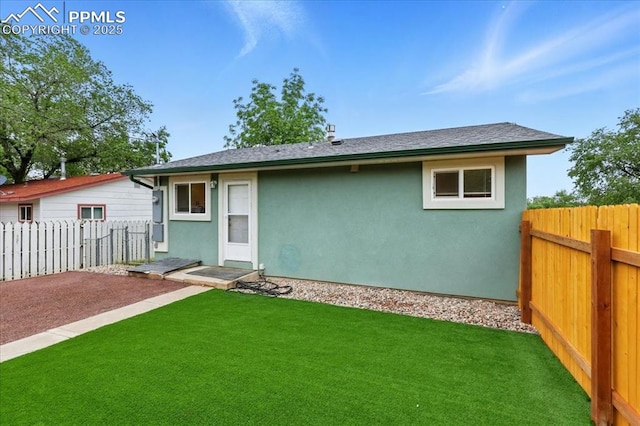 1112 Modes St, Colorado Springs, CO 80904 - rear view of property featuring stucco siding