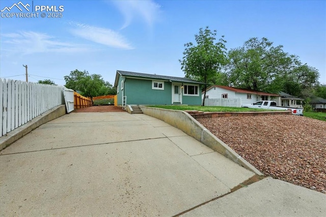 1112 Modes St, Colorado Springs, CO 80904 - ranch-style home featuring concrete driveway and stucco siding