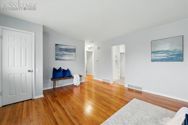1112 Modes St, Colorado Springs, CO 80904 - living area featuring light wood-style floors and baseboards