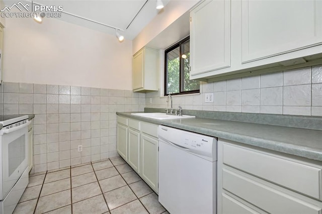 4059 Cooke Ln, Colorado Springs, CO 80911 - kitchen featuring white appliances, tile walls, light countertops, light tile patterned floors, and white cabinetry