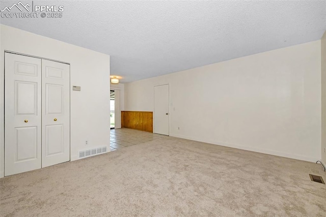 4059 Cooke Ln, Colorado Springs, CO 80911 - unfurnished living room with carpet floors and a textured ceiling