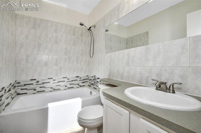 4059 Cooke Ln, Colorado Springs, CO 80911 - full bath with shower / bathtub combination, vanity, tile walls, and decorative backsplash