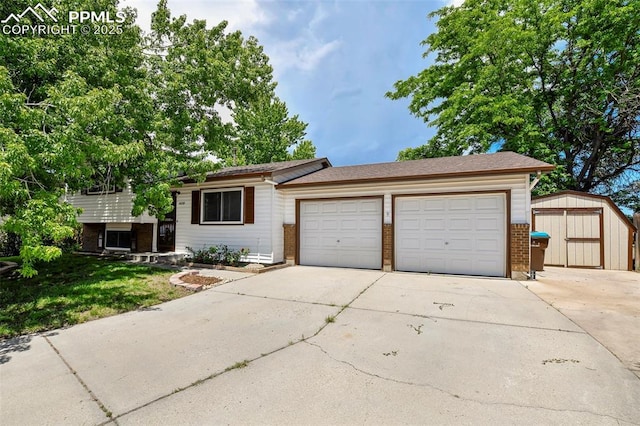 4059 Cooke Ln, Colorado Springs, CO 80911 - split level home featuring brick siding, driveway, a storage unit, and a garage