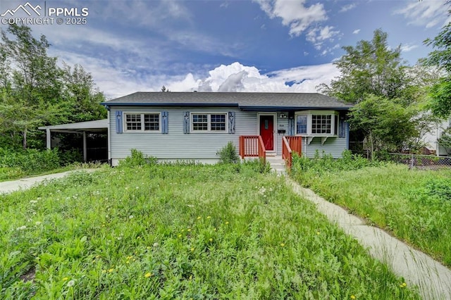 3118 E Ln Salle St, Colorado Springs, CO 80909 - single story home featuring a carport