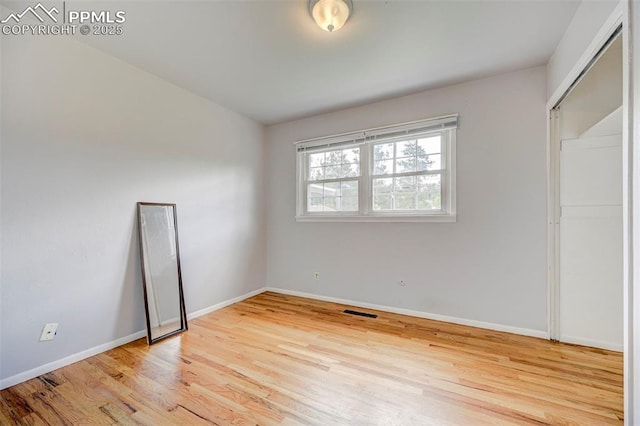 3118 E Ln Salle St, Colorado Springs, CO 80909 - unfurnished bedroom featuring wood finished floors and baseboards