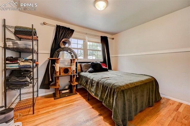 3118 E Ln Salle St, Colorado Springs, CO 80909 - bedroom with wood finished floors and baseboards