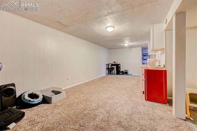 3118 E Ln Salle St, Colorado Springs, CO 80909 - finished basement featuring carpet flooring and a textured ceiling
