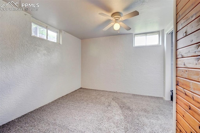 3118 E Ln Salle St, Colorado Springs, CO 80909 - below grade area featuring a textured wall, carpet flooring, plenty of natural light, and ceiling fan