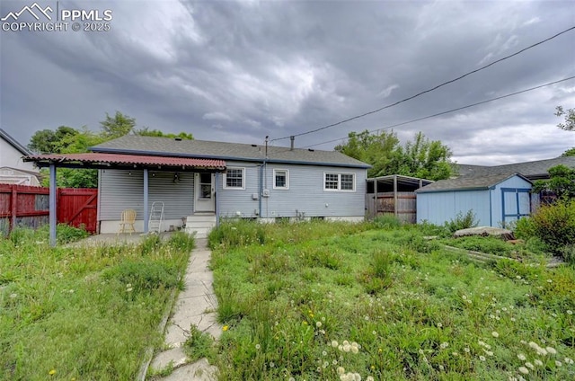 3118 E Ln Salle St, Colorado Springs, CO 80909 - back of property featuring a storage shed