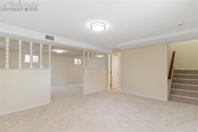 1411 Acacia Dr, Colorado Springs, CO 80907 - basement featuring carpet and stairs