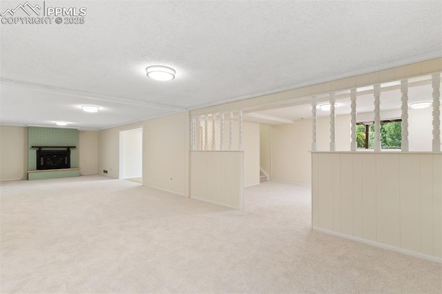 1411 Acacia Dr, Colorado Springs, CO 80907 - below grade area featuring a fireplace, carpet flooring, a textured ceiling, and stairway