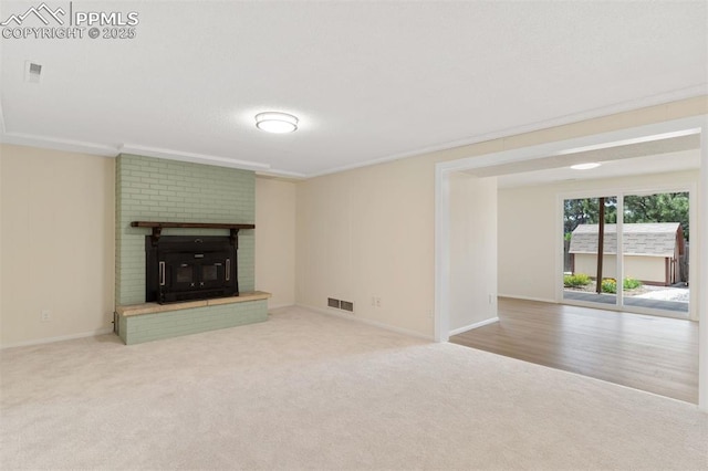 1411 Acacia Dr, Colorado Springs, CO 80907 - unfurnished living room with carpet flooring and a fireplace