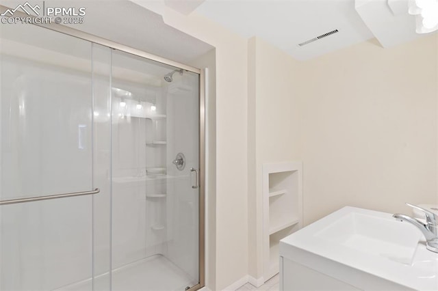 1411 Acacia Dr, Colorado Springs, CO 80907 - bathroom featuring a stall shower and vanity
