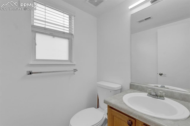 5105 Stellar Dr, Colorado Springs, CO 80923 - half bath featuring vanity and toilet
