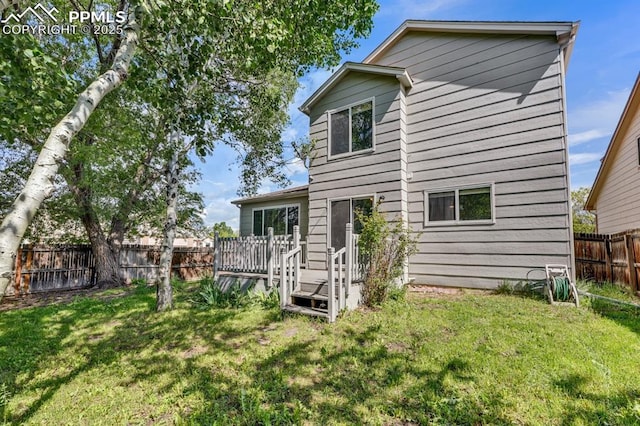 5105 Stellar Dr, Colorado Springs, CO 80923 - back of house featuring a fenced backyard and a wooden deck