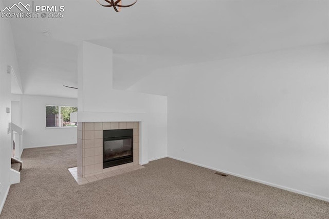 5105 Stellar Dr, Colorado Springs, CO 80923 - unfurnished living room with carpet and a tile fireplace