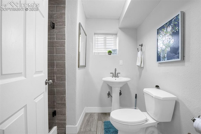 519 Crest St, Fountain, CO 80817 - bathroom with toilet and wood finished floors