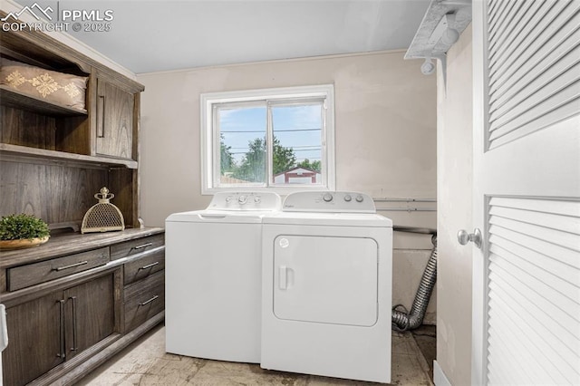 519 Crest St, Fountain, CO 80817 - laundry room with washing machine and clothes dryer and cabinet space