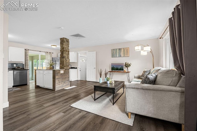 519 Crest St, Fountain, CO 80817 - living area featuring dark wood-style floors and baseboards