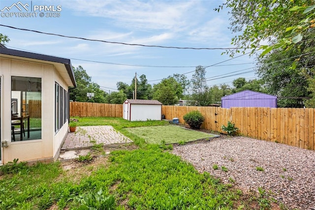 519 Crest St, Fountain, CO 80817 - fenced backyard with a storage shed and a patio area