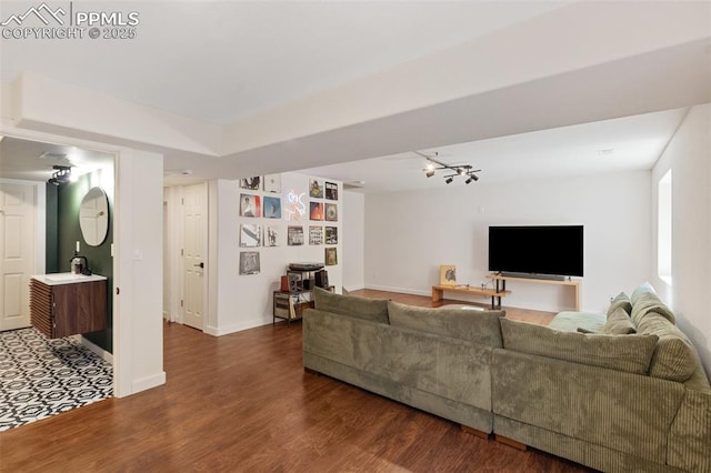 3320 Chestnut Glen Ln, Colorado Springs, CO 80918 - living room with wood finished floors, rail lighting, and baseboards