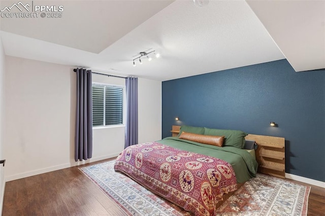 3320 Chestnut Glen Ln, Colorado Springs, CO 80918 - bedroom featuring wood finished floors and baseboards