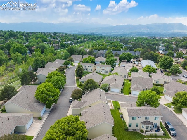3320 Chestnut Glen Ln, Colorado Springs, CO 80918 - aerial perspective of suburban area featuring a mountainous background