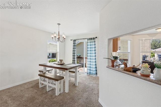 3320 Chestnut Glen Ln, Colorado Springs, CO 80918 - dining room featuring carpet floors, a chandelier, and baseboards