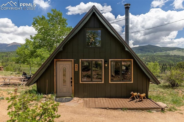 860 Golden Cycle Cir, Cripple Creek, CO 80813 - a-frame style home featuring a mountain view and board and batten siding