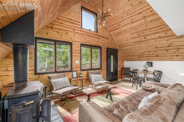 860 Golden Cycle Cir, Cripple Creek, CO 80813 - living room featuring wooden ceiling, lofted ceiling, wood walls, wood finished floors, and a wood stove
