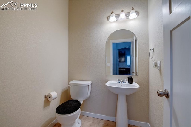 2485 Falkirk Dr, Colorado Springs, CO 80910 - half bath with toilet, tile patterned flooring, and a sink