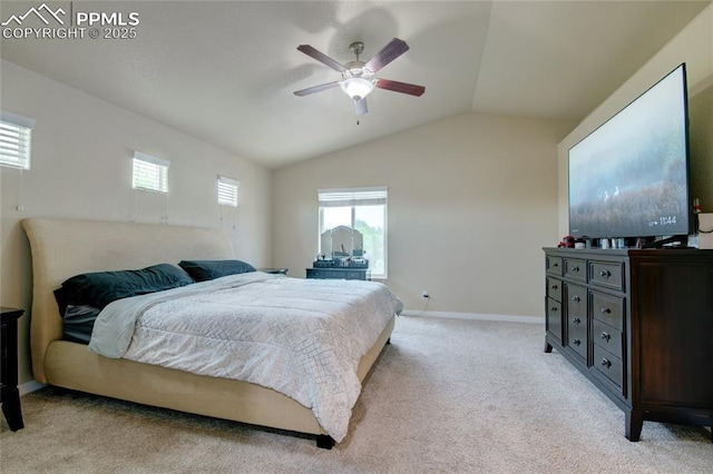 2485 Falkirk Dr, Colorado Springs, CO 80910 - bedroom featuring light colored carpet, multiple windows, vaulted ceiling, baseboards, and a ceiling fan