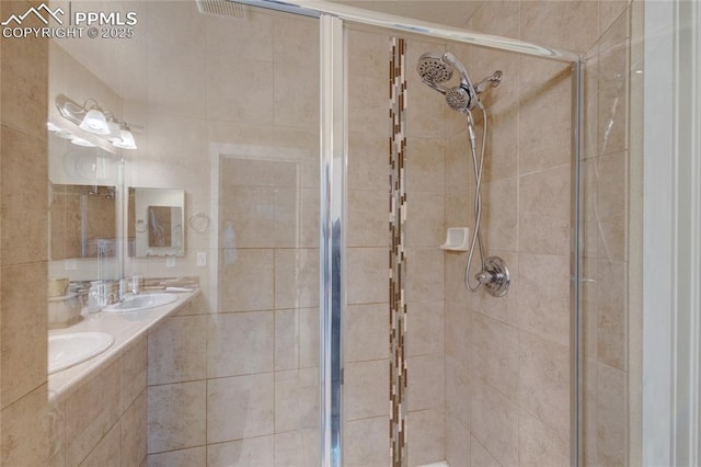 2485 Falkirk Dr, Colorado Springs, CO 80910 - full bathroom with a shower stall and double vanity