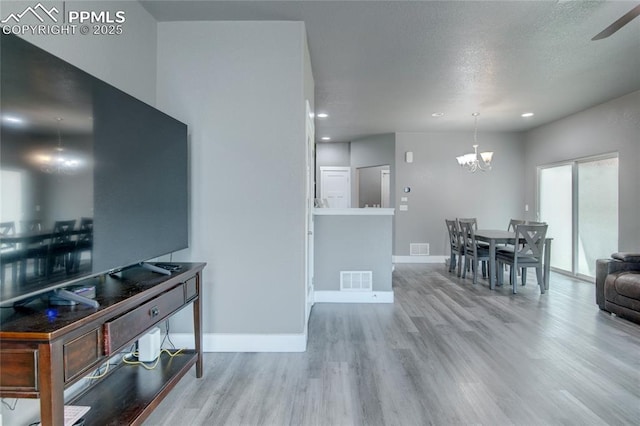 2485 Falkirk Dr, Colorado Springs, CO 80910 - kitchen featuring a chandelier, wood finished floors, baseboards, recessed lighting, and ceiling fan
