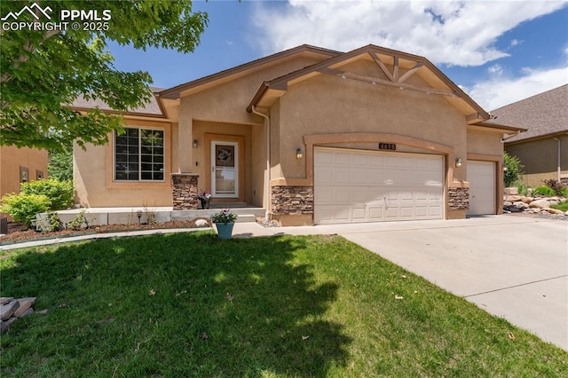 4410 Campus Bluffs Ct, Colorado Springs, CO 80918 - view of front facade featuring stucco siding, a garage, driveway, a front lawn, and stone siding
