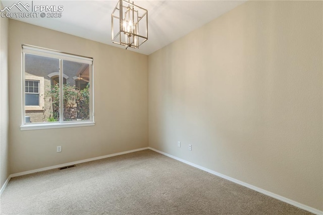 4410 Campus Bluffs Ct, Colorado Springs, CO 80918 - carpeted spare room with a chandelier and baseboards