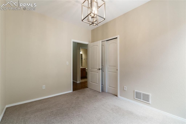4410 Campus Bluffs Ct, Colorado Springs, CO 80918 - carpeted empty room with a chandelier and baseboards