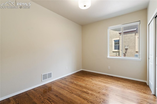 4410 Campus Bluffs Ct, Colorado Springs, CO 80918 - empty room featuring wood finished floors and baseboards
