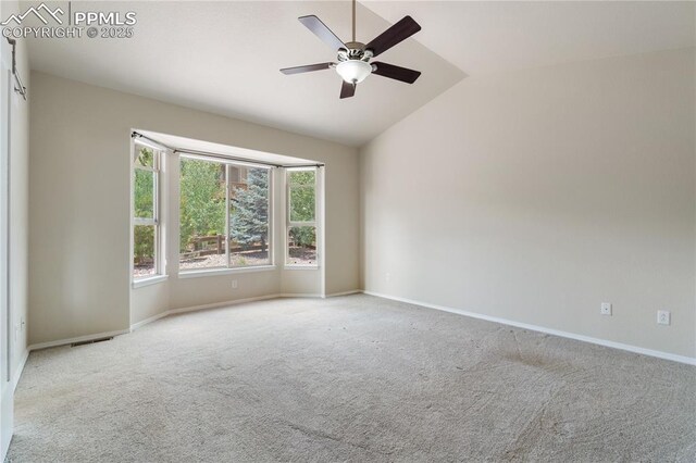 4410 Campus Bluffs Ct, Colorado Springs, CO 80918 - carpeted empty room featuring vaulted ceiling and a ceiling fan