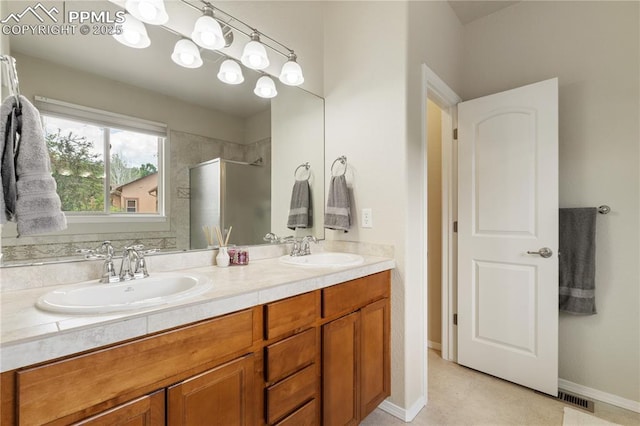4410 Campus Bluffs Ct, Colorado Springs, CO 80918 - bathroom with a shower stall and double vanity