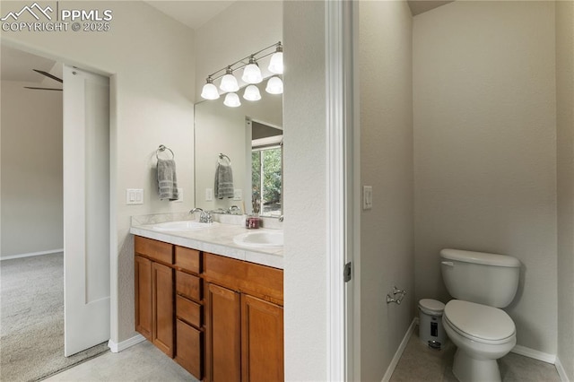 4410 Campus Bluffs Ct, Colorado Springs, CO 80918 - bathroom featuring double vanity and toilet